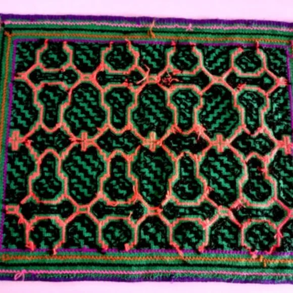 Hand embroidered shipibo altar design multicolored patterns Amazon jungle